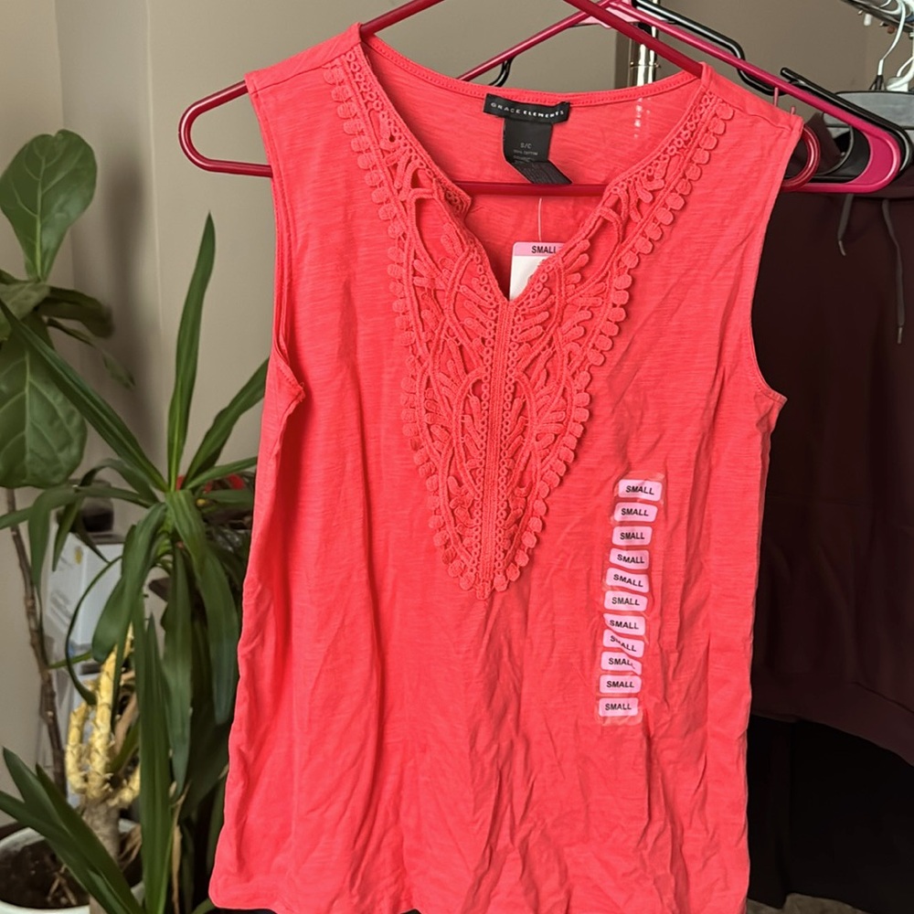Never worn with tags, pink tank top
